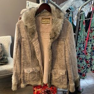 Tan jacket with studs on back